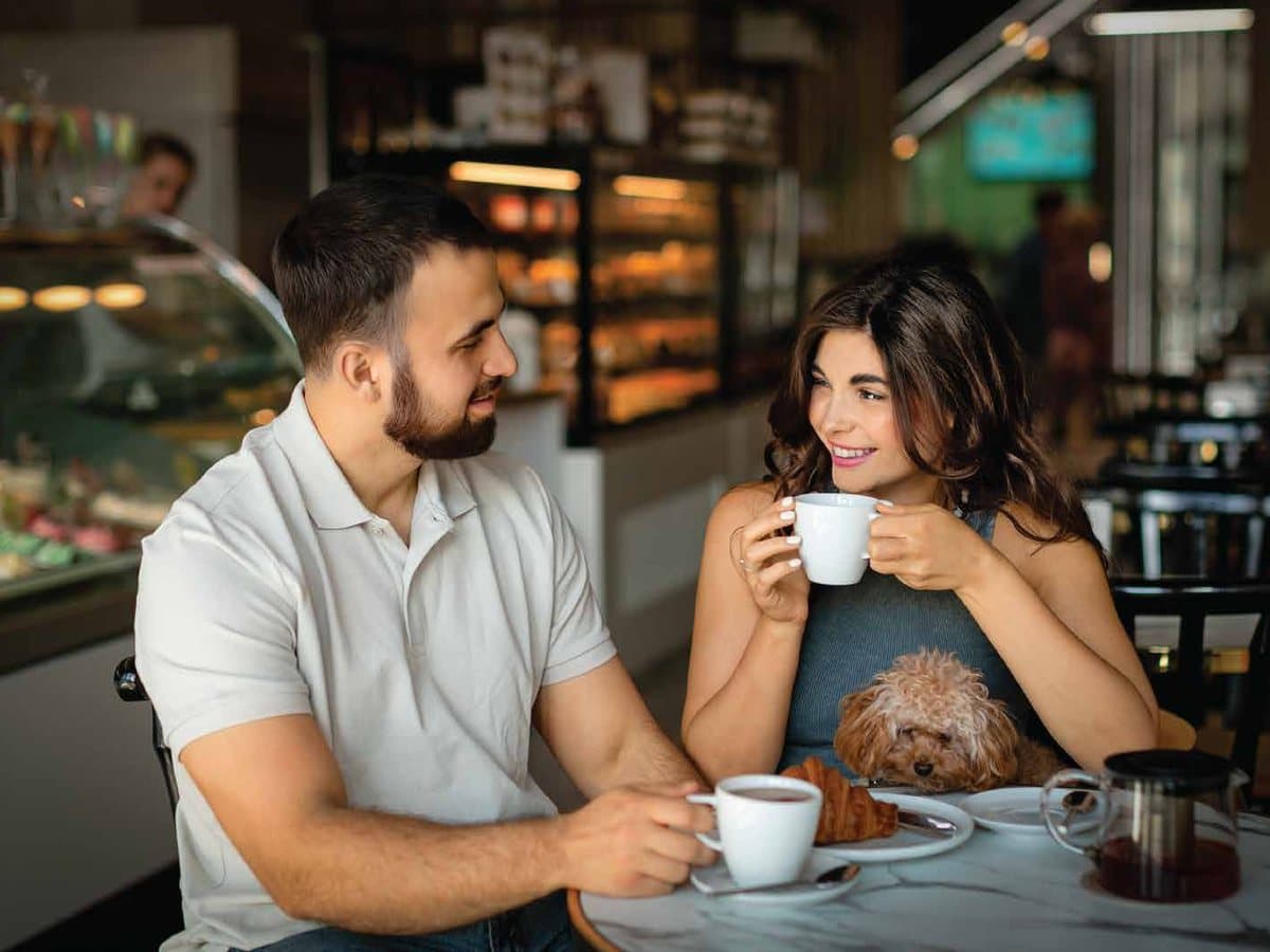 A couple sharing coffee in a café